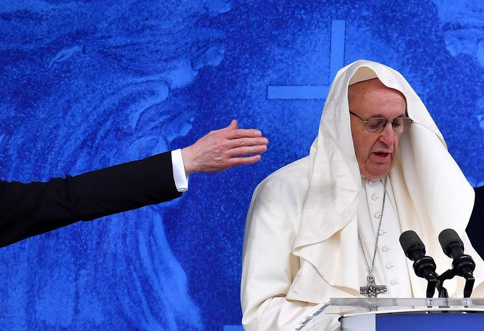 The wind catches the Pope's mozzetta as he recites the Angelus at the Knock shrine