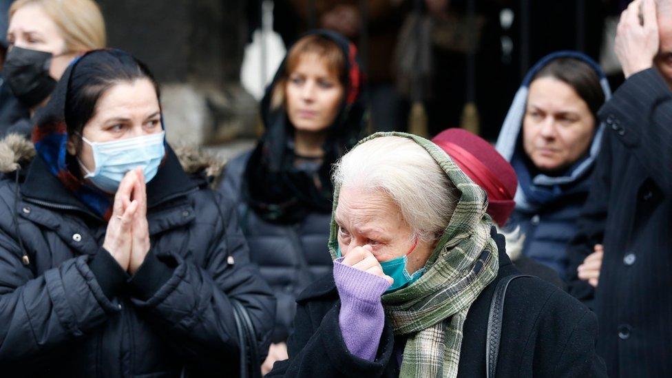 Orthodox believers mourn the late Serbian Patriarch Irinej in Belgrade, Serbia, 21 November 2020.