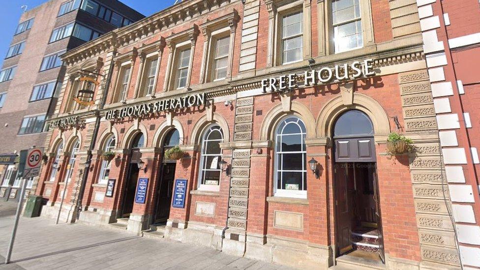 Street view of a pub entrance