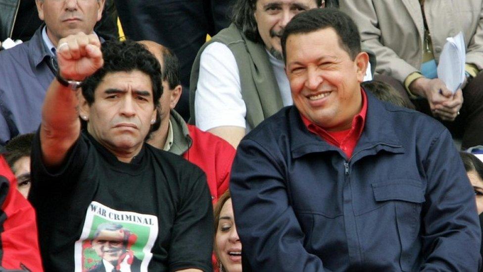 Argentine former soccer star Diego Armando Maradona (L) gestures next to Venezuelan President Hugo Chavez during the "People's Summit" massive rally against the IV Summit of the Americas, in Mar del Plata's stadium 04 November, 2005.