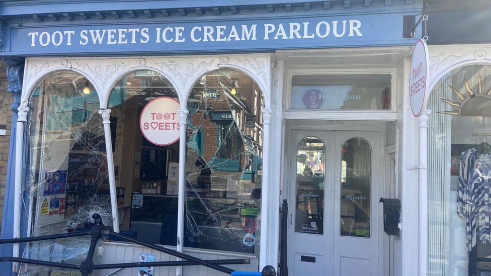 ice cream shop with smashed window