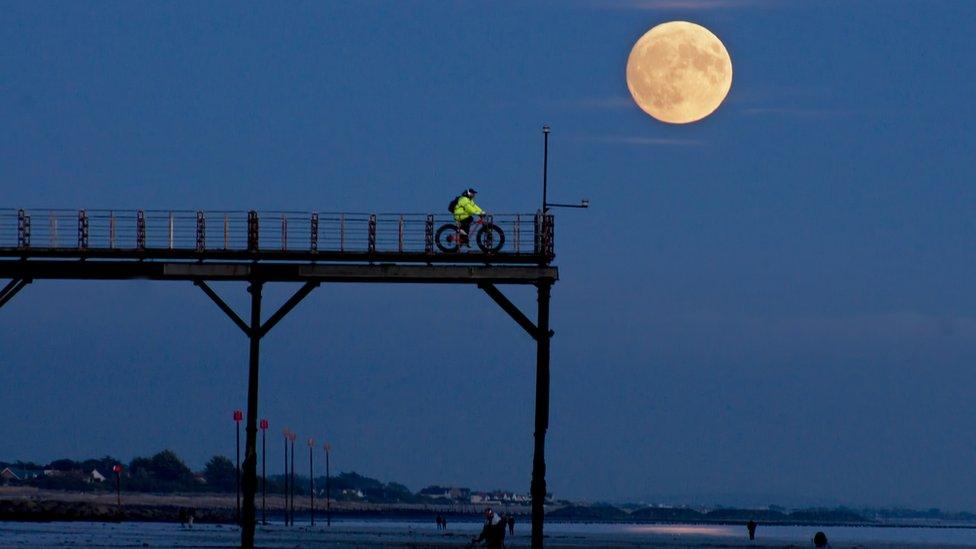 The full moon over the pier in Bognor Regis