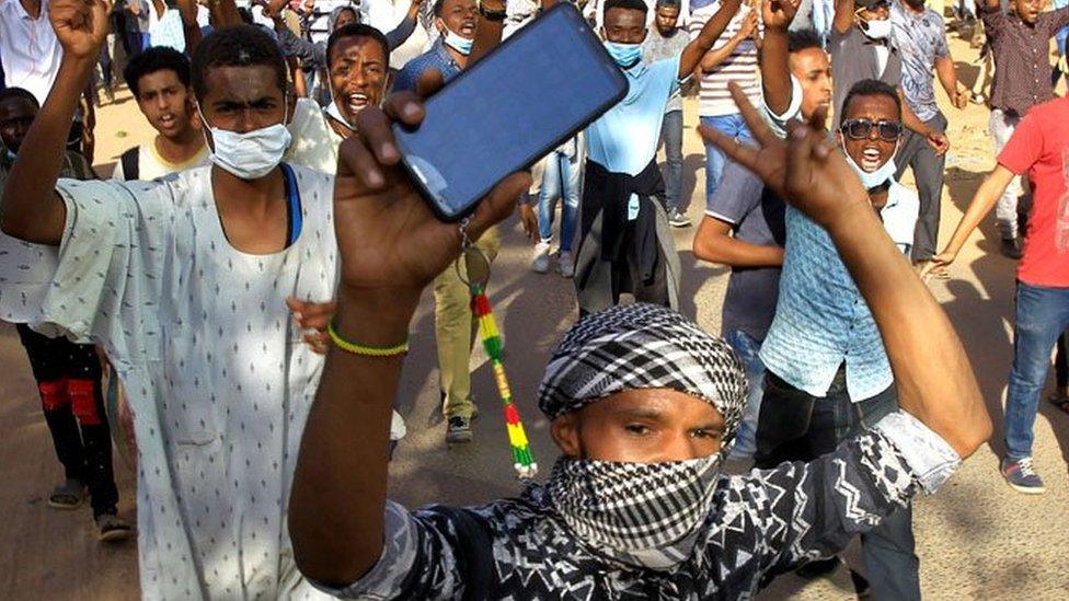 Sudanese demonstrators chant slogans as they march along the street during anti-government protests in Khartoum, Sudan December 25, 2018