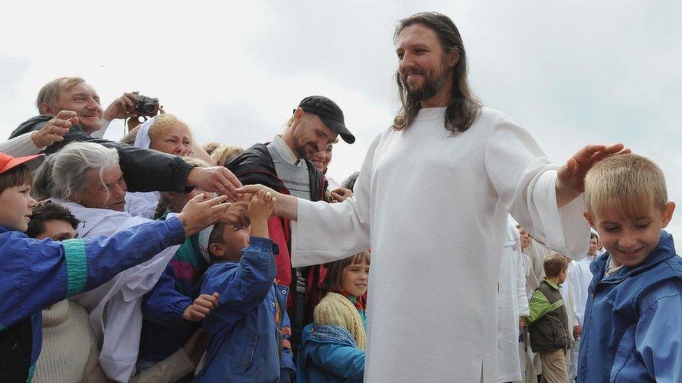 Image shows Sergei Torop with his followers in 2009