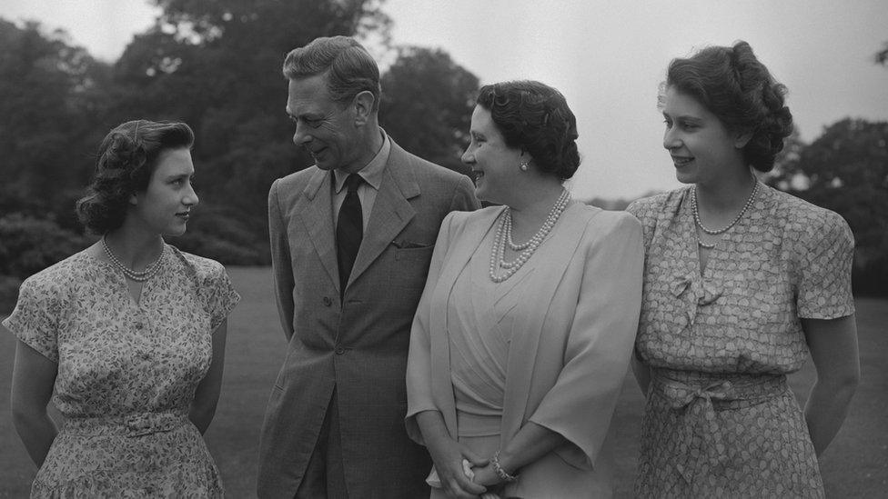 Princess Margaret (1930-2002), King George VI (1895-1952), Queen Elizabeth, The Queen Mother (1900-2002) and Princess Elizabeth (Queen Elizabeth II) in the grounds of Windsor Castle, Berkshire, 8 July 1946