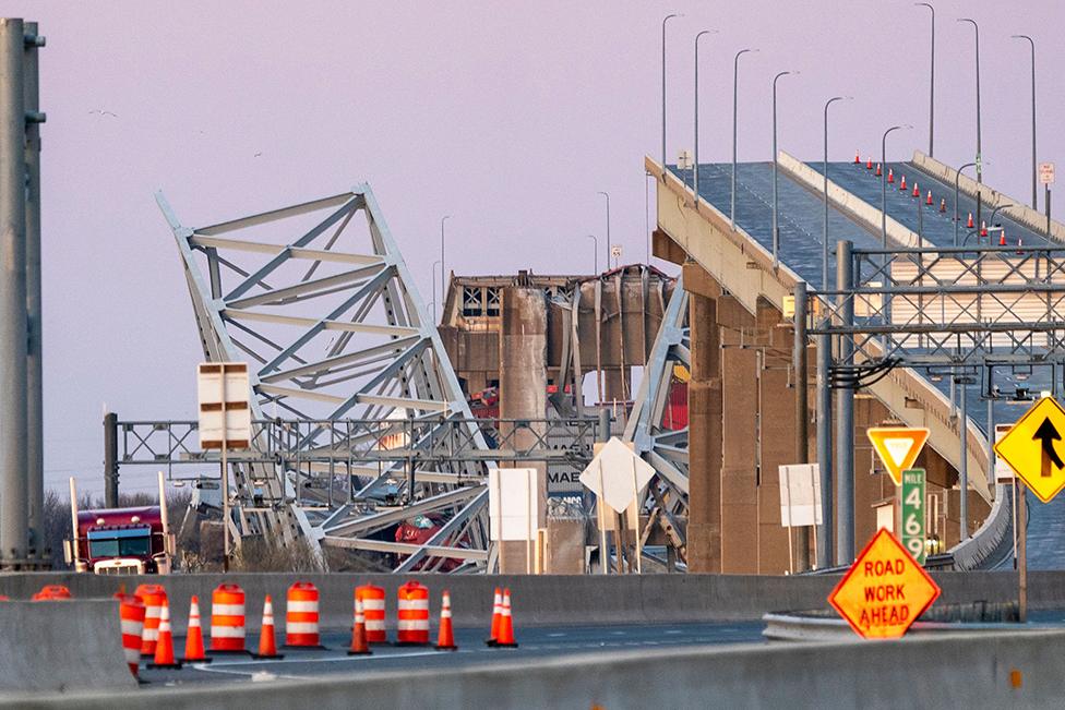 The Francis Scott Key Bridge rests partially collapsed after a cargo ship ran into it in Baltimore, Maryland, USA, on 26 March 2024