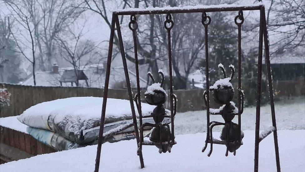 Snow on garden ornaments