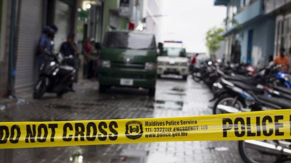 Maldives police cordon off the area as the house associated with Vice President Ahmed Adeeb is searched in Male (24 October 2015)