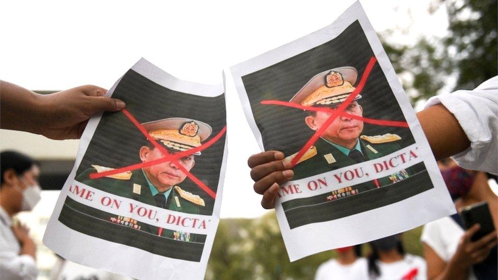 Banners decrying the general as a dictator