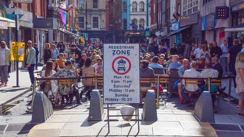 Outdoor diners on a sunny summer's day in Soho