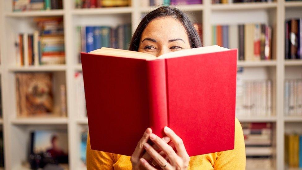 Picture of a woman holding a book