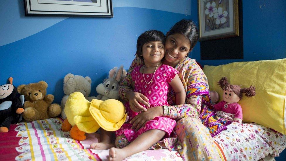 This undated handout photo released on 28 April 2017 by the Children First Foundation shows three-year-old Choity Khatun (L) with her mother Shima (R) in hospital in Melbourne after she had life-saving reconstructive surgery