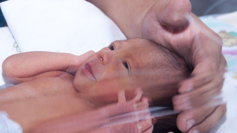 Baby in incubator