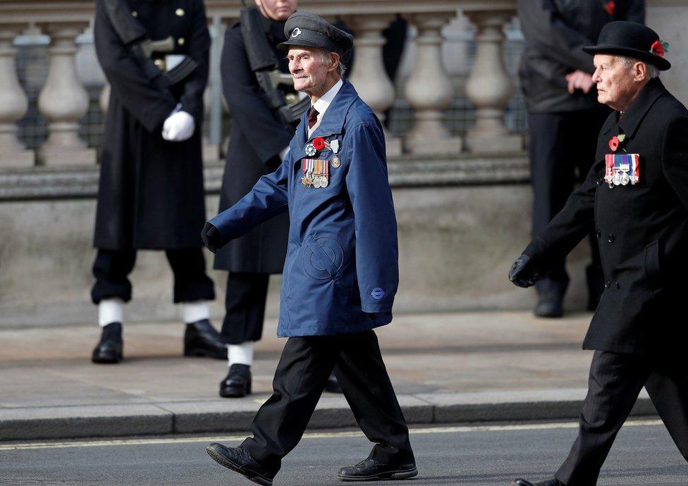 D-Day veteran John Aichison, 96, (centre)attends the Remembrance Sunday service at the Cenotaph, in Whitehall, London.