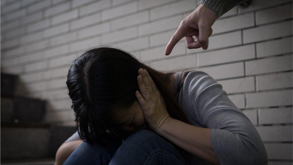 Woman being shouted at (posed photo)