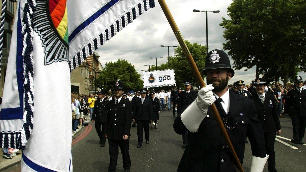 Gay police officers marching in uniform at Gay Pride 2003