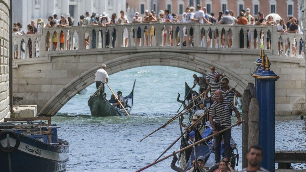 Venice tourists and river