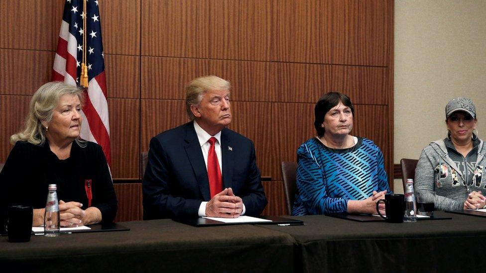 Republican presidential nominee Donald Trump sits with (from R-L) Paula Jones, Kathy Shelton and Juanita Broaddrick, in a hotel conference room in St. Louis, Missouri, U.S. 9 October 2016