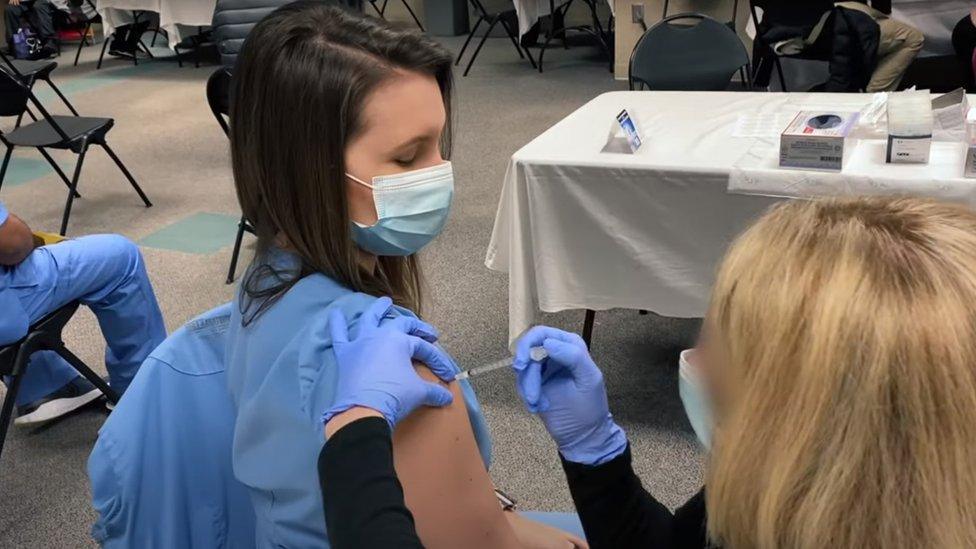 A woman being vaccinated for Covid-19 in Budweiser's 2021 Super Bowl ad