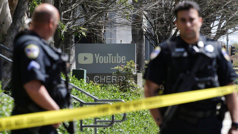 Police officers and crime scene tape are seen at Youtube headquarters