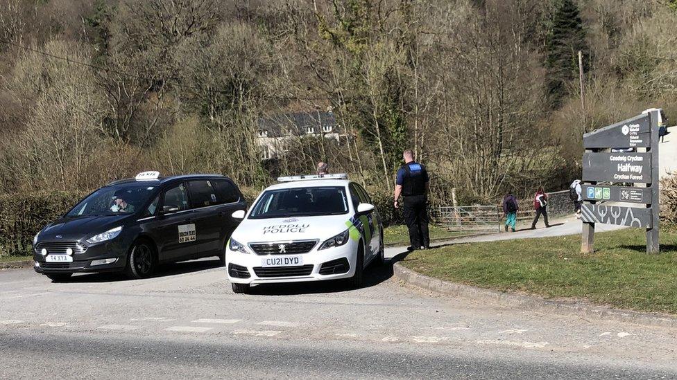 police at entrance to land