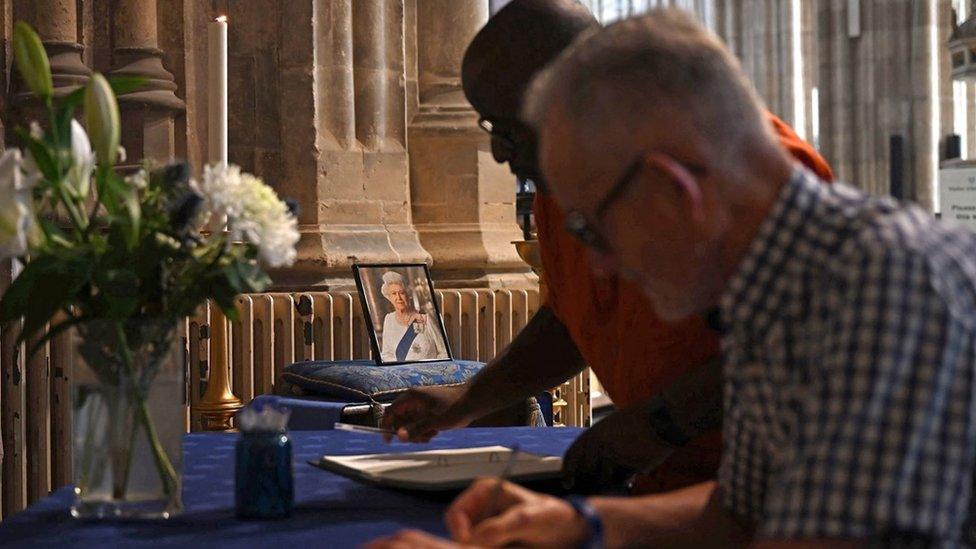 Members of the public signing books of condolence at Canterbury Cathedral