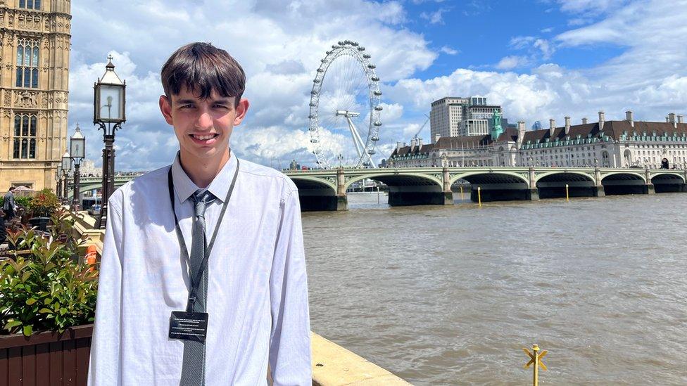 Callum Smith in London stood by the River Thames