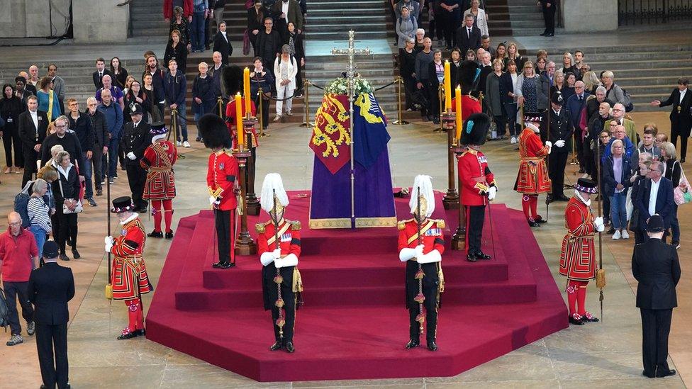 Members of the public filing past the coffin of Queen Elizabeth II