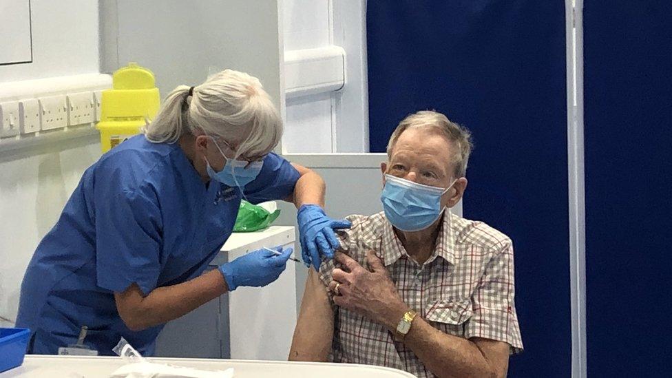 Dan Jones is vaccinated against Covid-19 at Ysbyty Enfys vaccination hub at Bangor University's Brailsford Centre in Bangor, Gwynedd, on 7 January, 2021