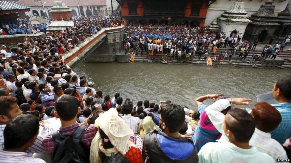 People gather in Kathmandu to observe the cremation of Senior Superintendent of Police Laxman Neupane, killed in Monday's protest at Tikapur in Kailali district - 25 August 2015