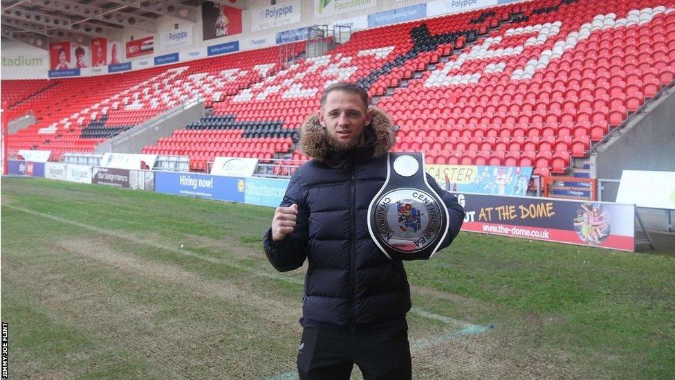 Jimmy Joe Flint holding the belt