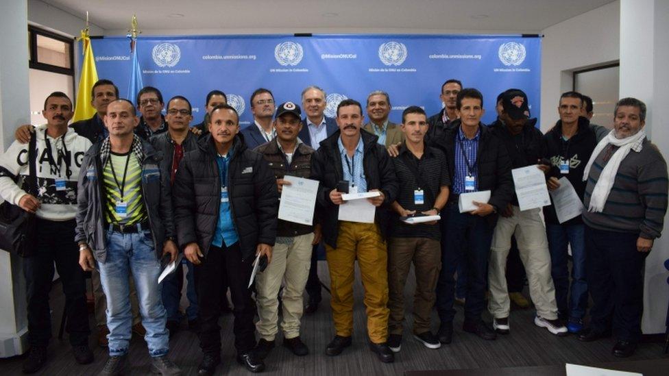 UN Secretary General's Special Representative for Colombia and Head of the UN Mission to Colombia, Jean Arnault (C), Revolutionary Armed Forces of Colombia (FARC) member Marco Calarca (R) and other members of the FARC