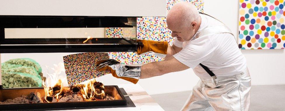 Damien Hirst burning his own artworks