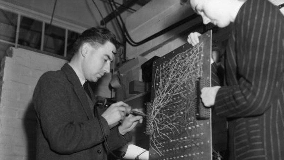 Technicians work on a utility model of Eniac