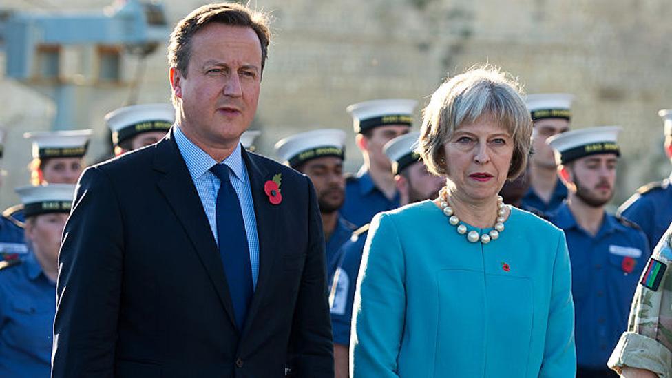 British Prime Minister David Cameron and Home Secretary Theresa May attend a remembrance service on HMS Bulwark during the Valletta Summit on migration on November 11, 2015 in Valletta, Malta