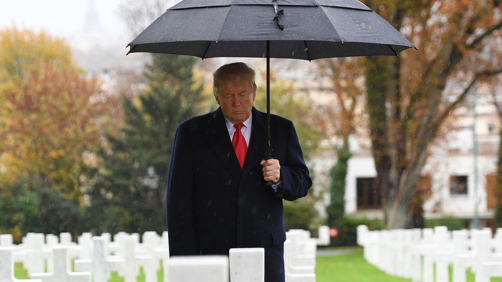 US President Donald Trump takes part in a ceremony at the American Cemetery of Suresnes, outside Paris