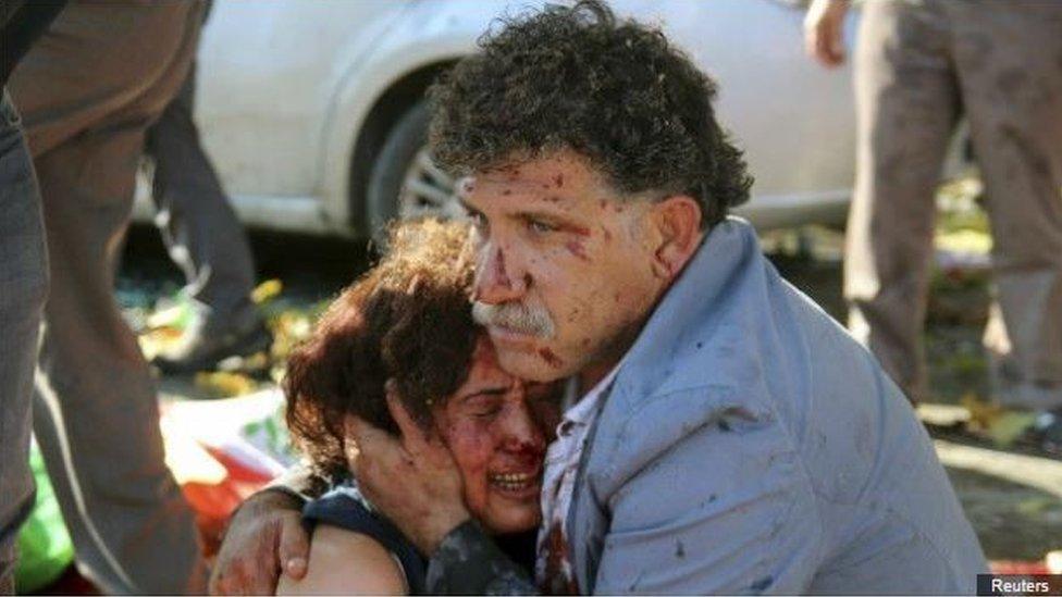 Izzettin Cevik and his wife Hatice Cevik in the aftermath of the blast