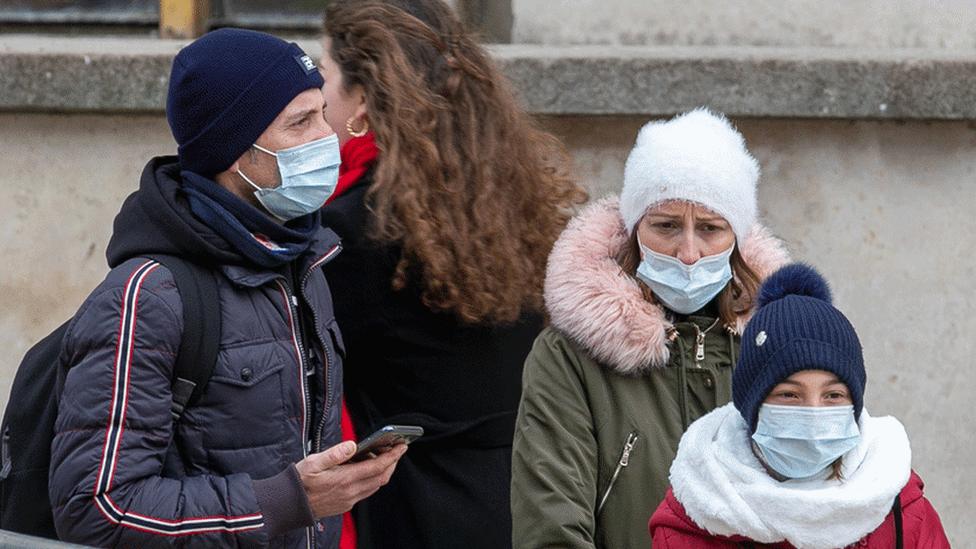 Family in face masks