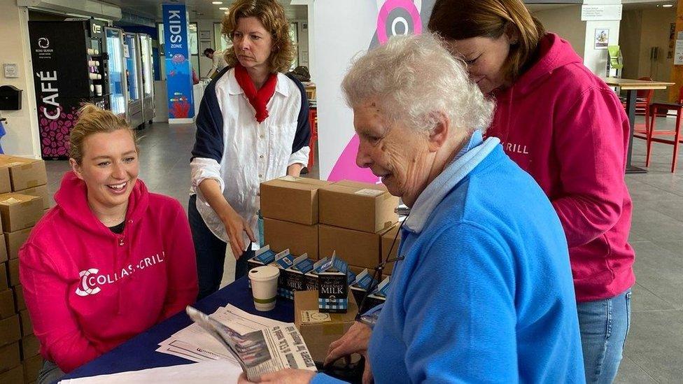 A resident collecting a hamper last year