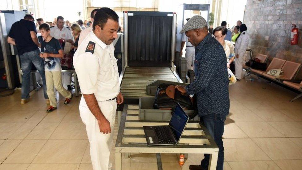 An Egyptian airport security officer checks a passenger's luggage in Sharm el-Sheikh. Photo: 6 November 2015