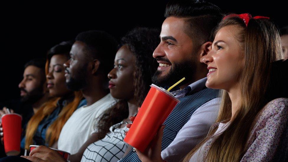 Cinema goers watching a film