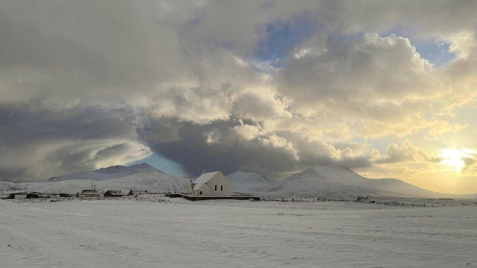 Snow completely covers the landscape in South Uist