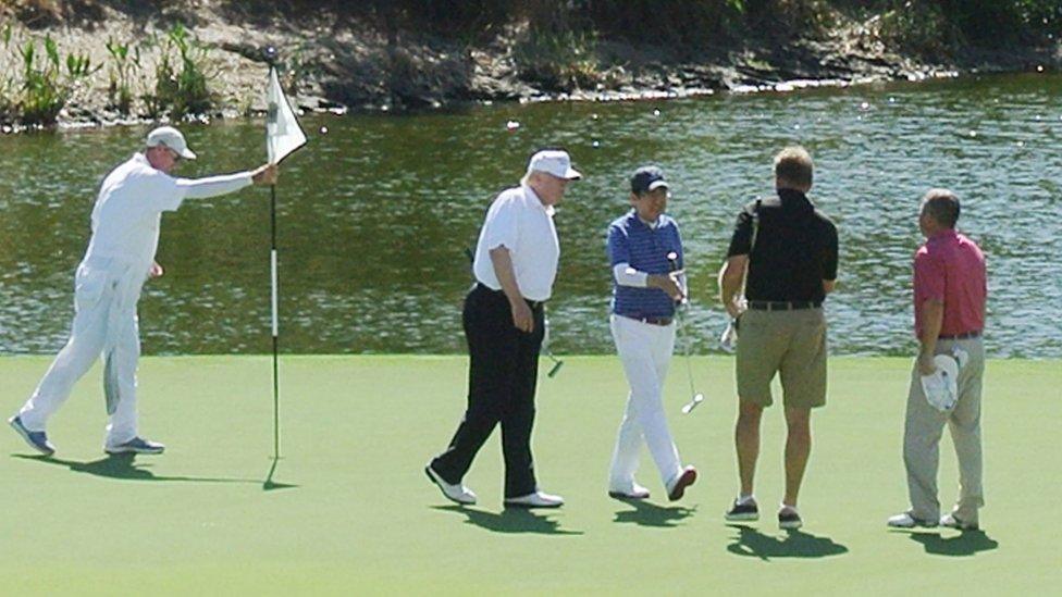 US President Donald Trump and Japan's Prime Minister Shinzo Abe play golf in Florida on 11 February, 2017