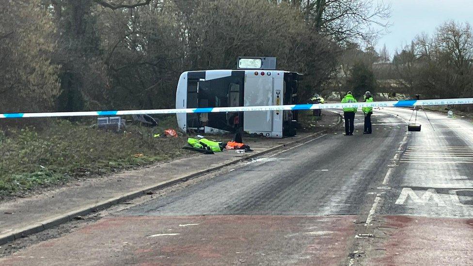 Double-decker bus on its side