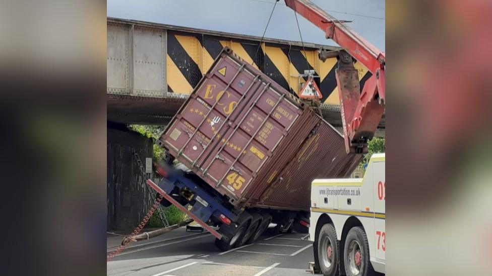 Lorry stuck under railway bridge