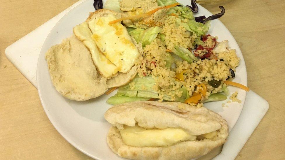 A plate of pitta, couscous and halloumi