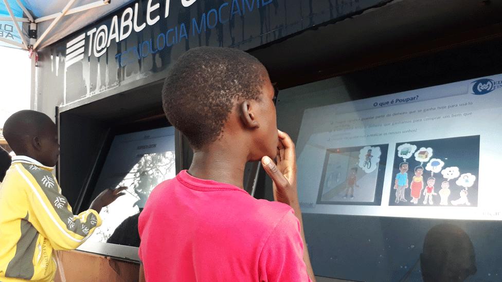 Boys using community tablet