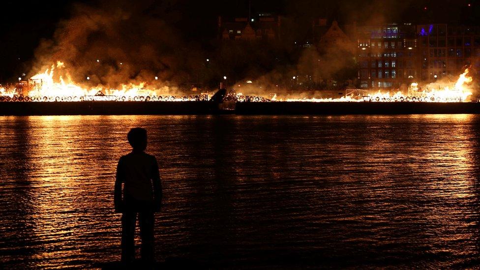 A model of London's skyline set alight