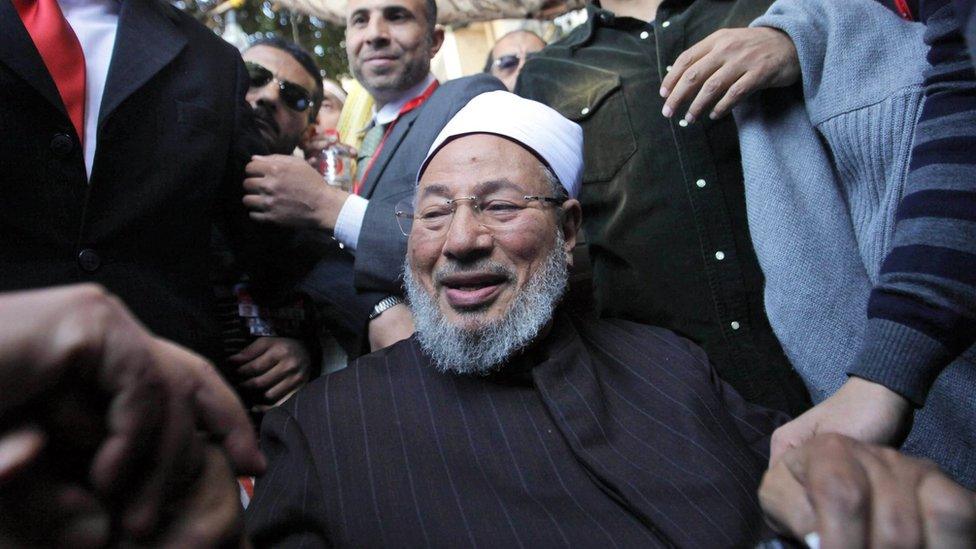 Muslim cleric Yusuf al-Qaradawi is welcomed by a crowd in Cairo's Tahrir Square on 18 February 2011