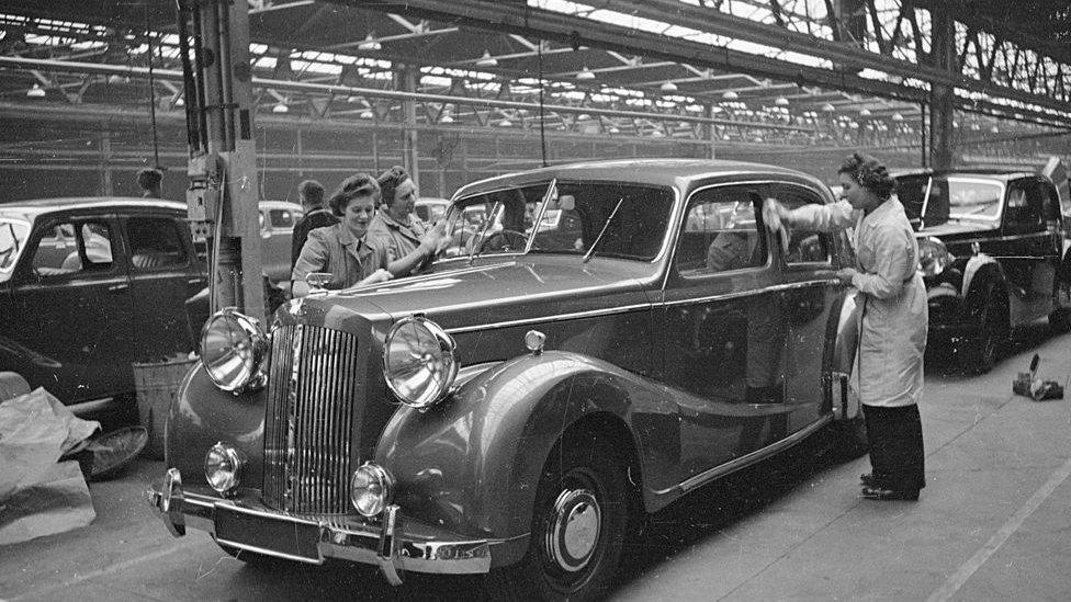 A Sheerline luxury saloon car being polished in the Austin Motor Company's Longbridge plant in Birmingham